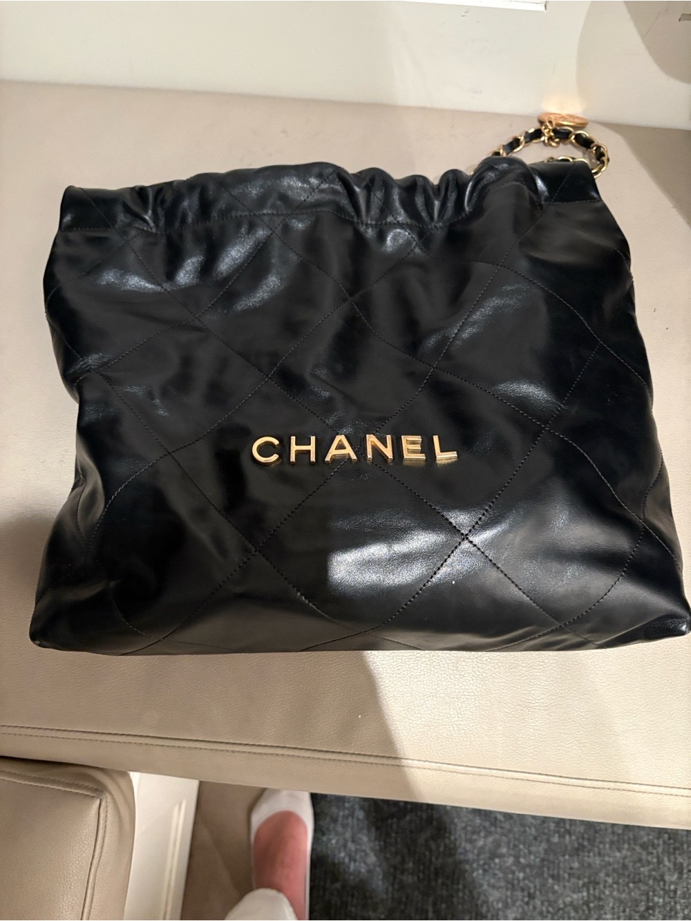 CHANEL Black Quilted Leather Shoulder Bag with Gold-Tone Logo